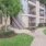 a building with a walkway and grass