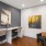 a room with a desk and chairs