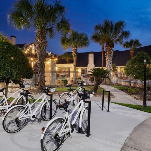A perfect fit for the whole family bicycles parked on a sidewalk