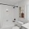 a bathroom with a shower and toilet