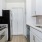 a kitchen with white cabinets